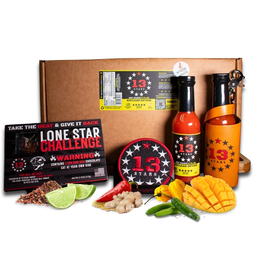 Spicy food kit with hot sauce bottles, snacks, and packaging on a white background